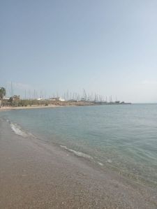 First walk with our feet in the sand in Greece! Marina in the foreground